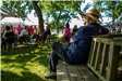 Man sitting on a park bench at Heritage Park