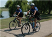 Two officers ride bikes