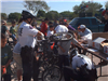 bike patrol fixes bike with citizens