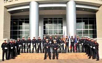 Honor guard poses with weapons